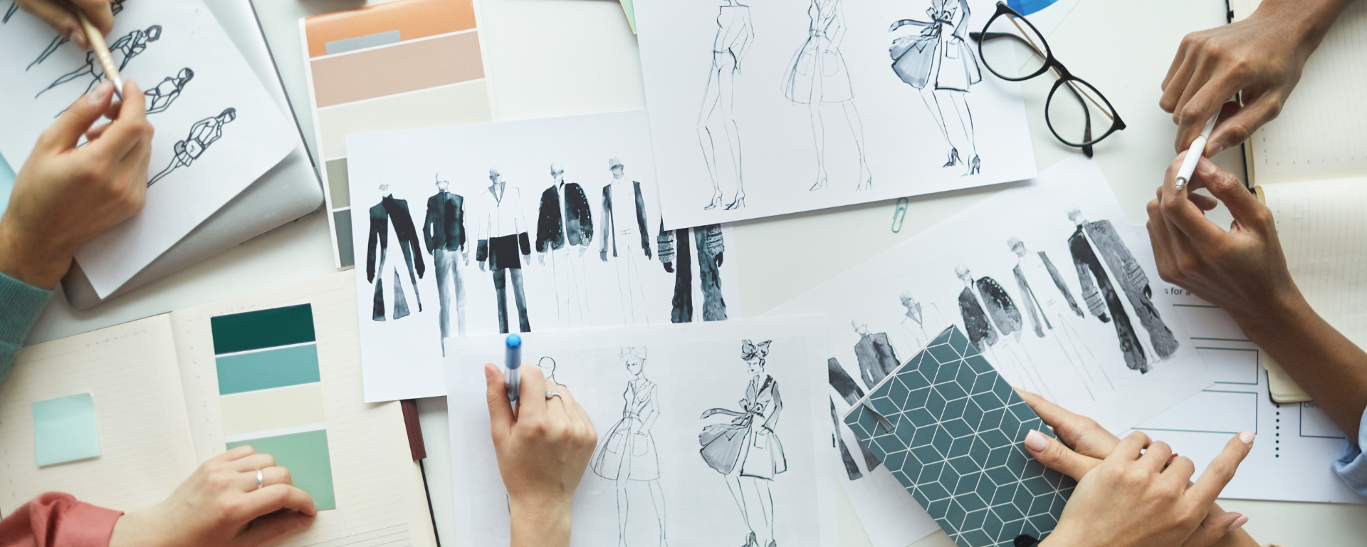 Design & Product Development 1 Apparel product development team reviewing tech pack designs